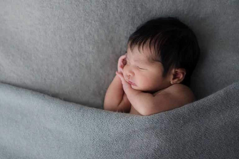 Sleeping Newborn Boy on Gray