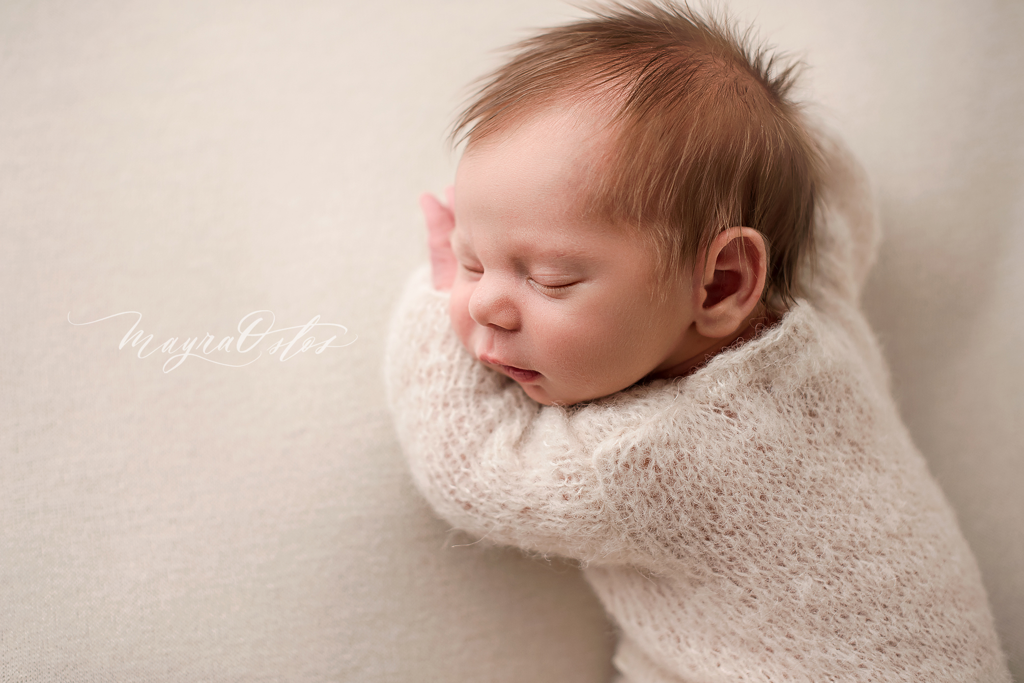 Newborn Boy in Cream Romper